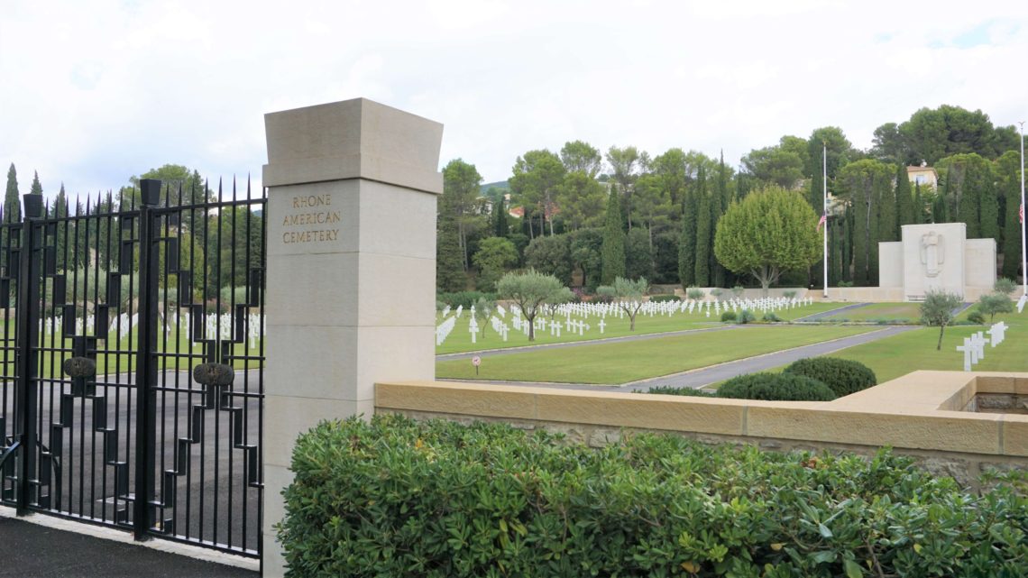 Rhone American Cemetery entrance with graves and chapel in the background