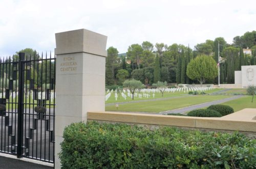 Rhone American Cemetery entrance with graves and chapel in the background