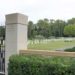 Rhone American Cemetery entrance with graves and chapel in the background