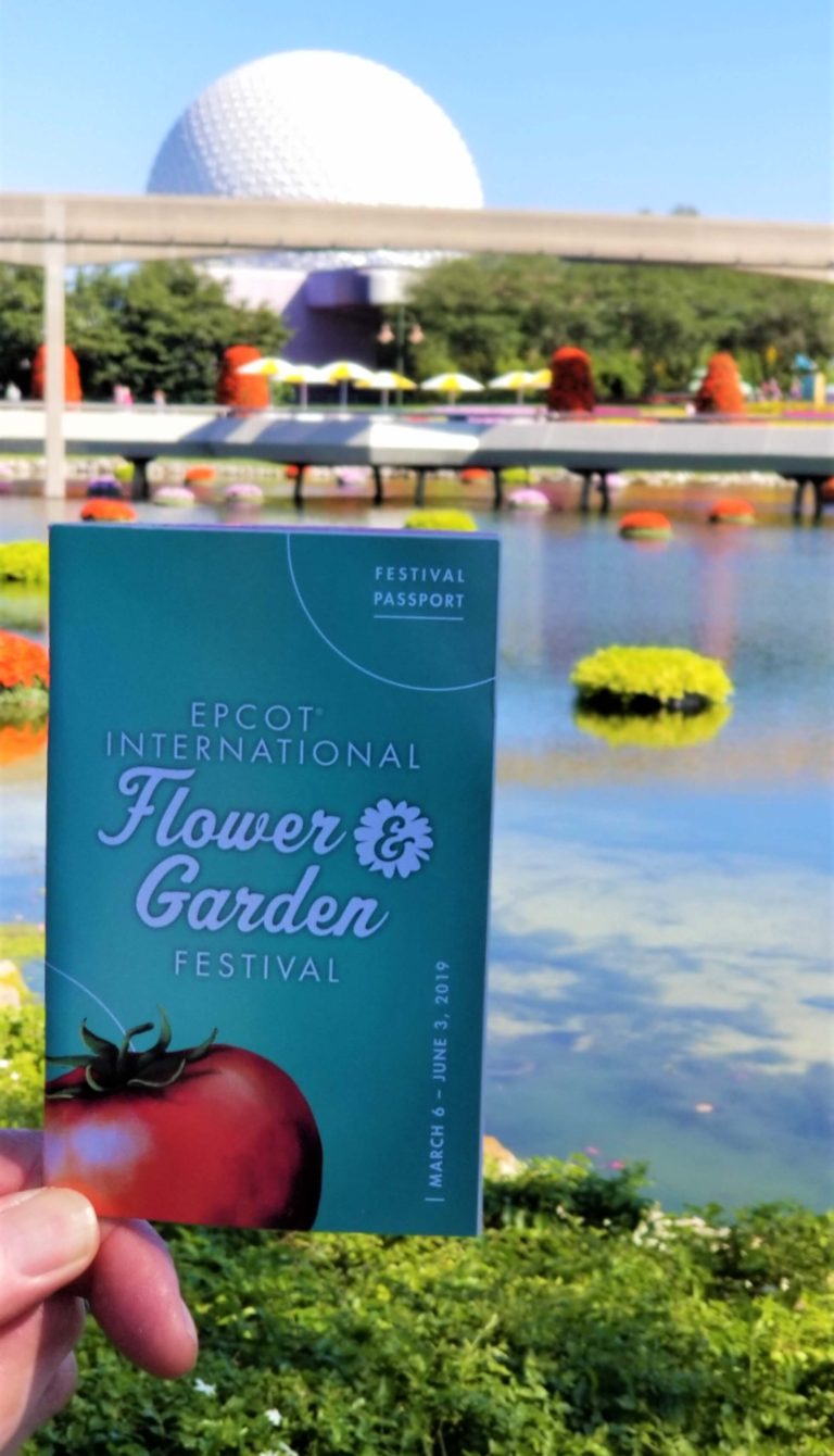 EPCOT flower and garden passport with spaceship earth and lake in the background