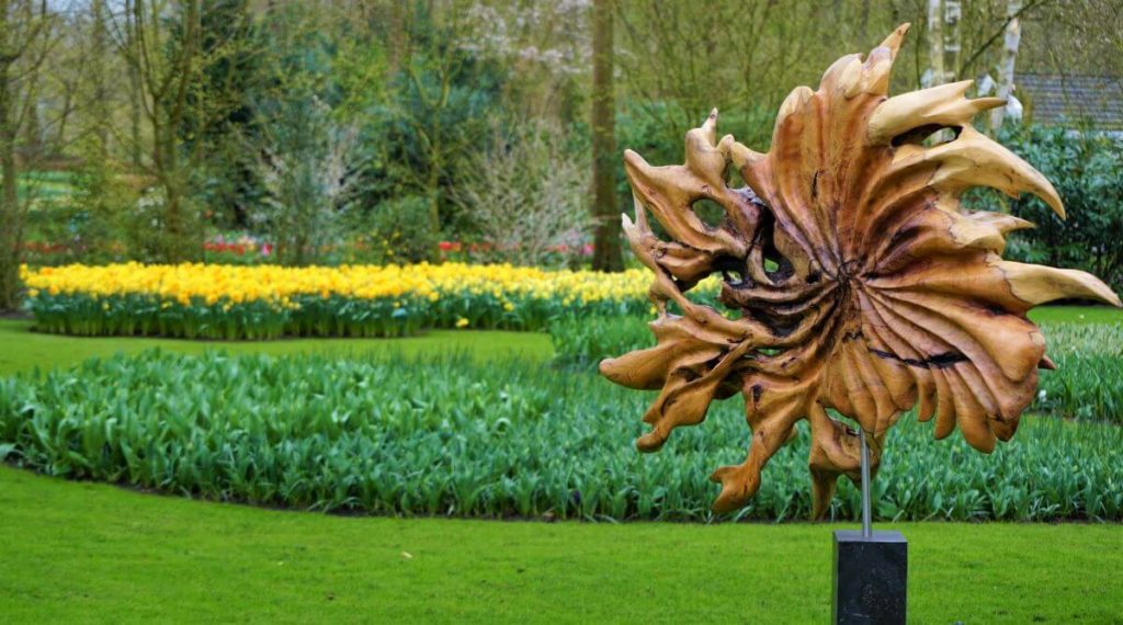 Carved wooden flower in a garden