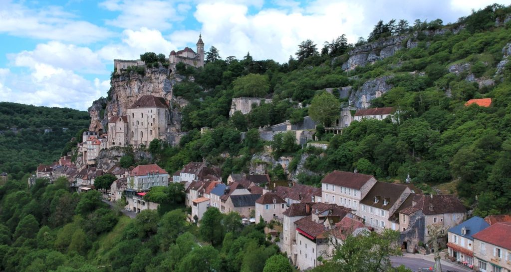 travel the french countryside to the town of rocamadour built into the side of the mountain